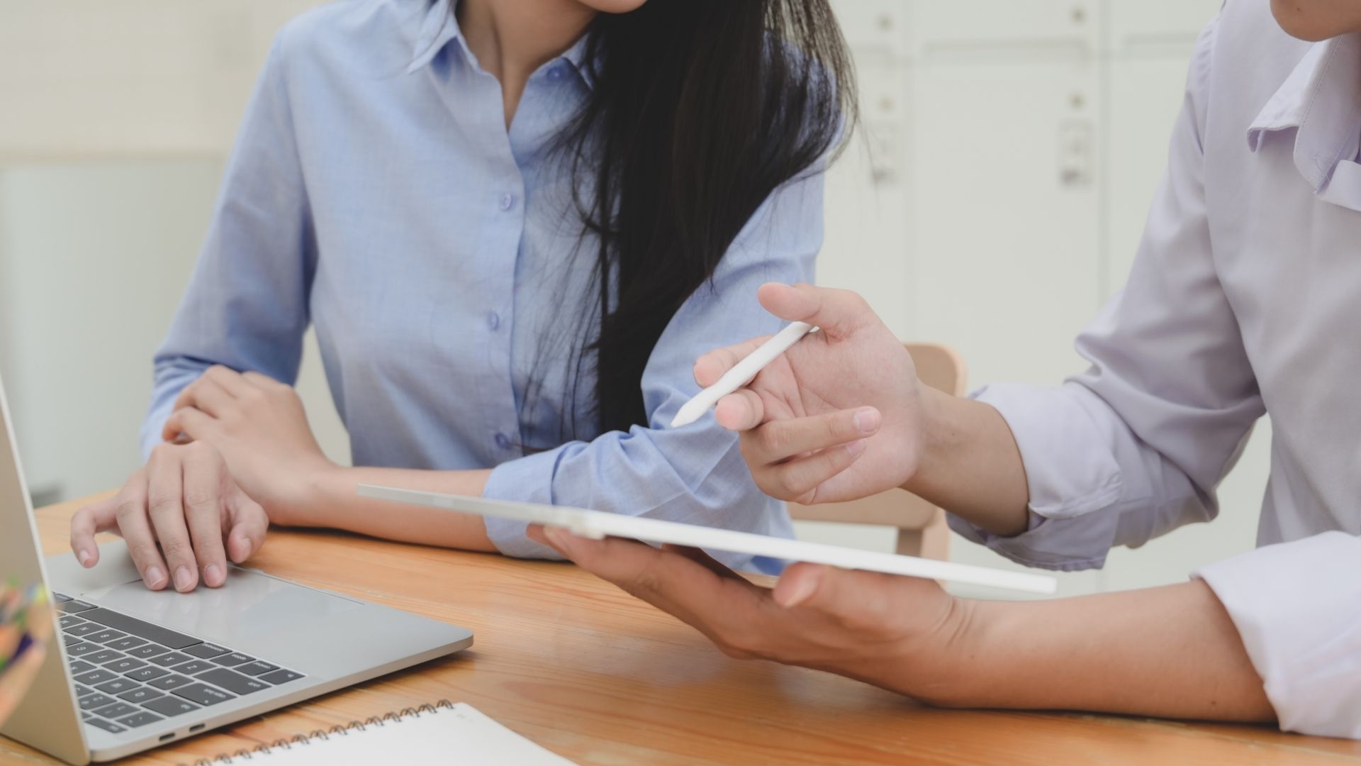 Colleagues organise conveyancing documents to lodge